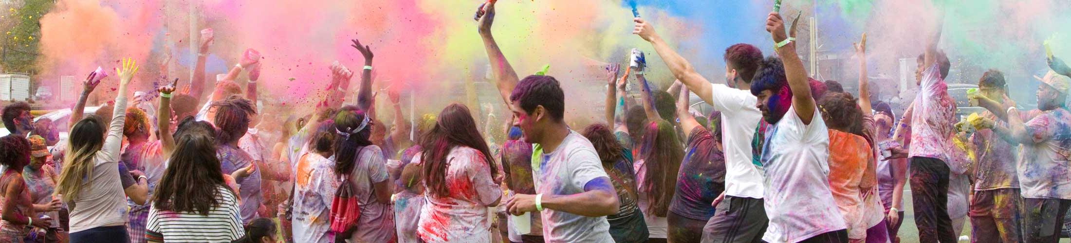 Students throwing color in event
